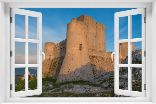 Fototapeta Naklejka Na Ścianę Okno 3D - Rocca Calascio (Italy) - The ruins of an old medieval village with castle and church, over 1400 meters above sea level on the Apennine mountains in the heart of Abruzzo, at sunset.