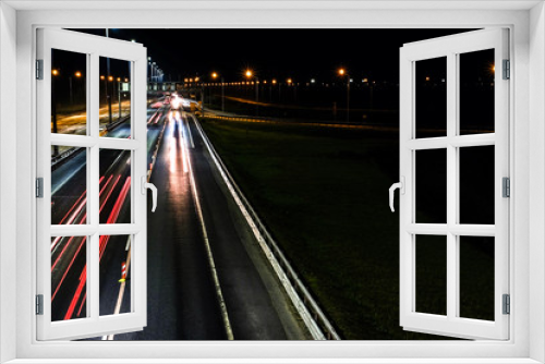 Fototapeta Naklejka Na Ścianę Okno 3D - Night shooting road. At night the city lights up. Lighting of the motorway.