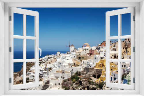 Fototapeta Naklejka Na Ścianę Okno 3D - Most Romantic Greek Oia town on Santorini island, Greece. Traditional and famous houses and churches with blue domes over the Caldera, Aegean sea. Santorini classically Thera and officially Thira.