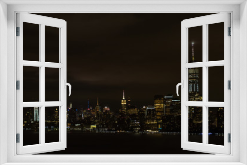 Fototapeta Naklejka Na Ścianę Okno 3D - Aerial night image of New York City Manhattan at night