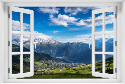 Fototapeta Naklejka Na Ścianę Okno 3D - Scenery view of Verbier village surrounded with beautiful Swiss Alps mountains in sunny summer day with green meadows, forests, blue sky.