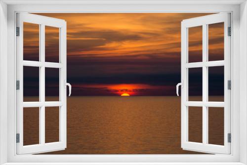 Fototapeta Naklejka Na Ścianę Okno 3D - 海に沈む夕陽