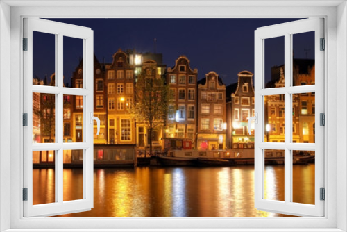 Fototapeta Naklejka Na Ścianę Okno 3D - Amsterdam waterfront houses at night, The Netherlands