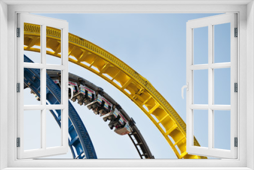 Fototapeta Naklejka Na Ścianę Okno 3D - Rollercoaster looping ride on fun fair