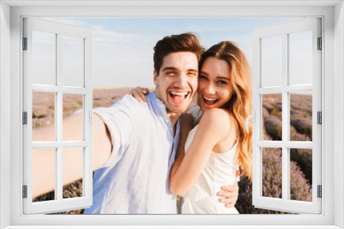 Happy young couple taking a selfie