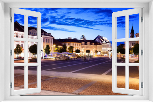 Fototapeta Naklejka Na Ścianę Okno 3D - Vilnius, the capital of Lithuania at sunset, a street and square with bright night lights in the historic center of the city at night, a popular destination for travel in Europe
