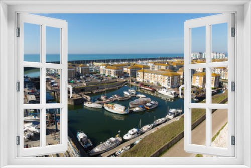 Fototapeta Naklejka Na Ścianę Okno 3D - Brighton marina boats and buildings in East Sussex England UK near Eastbourne 