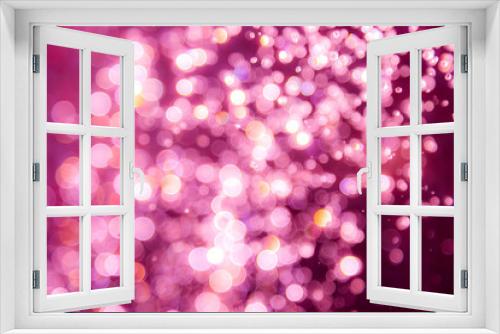 Pink bokeh of water drops levitating in the air reflection