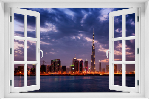Fototapeta Naklejka Na Ścianę Okno 3D - Beautiful night dubai downtown skyline. Fastinaciting reflection of skyscrapers in Business Bay area, Dubai, United Arab Emirates