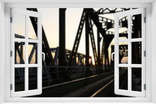 Fototapeta Naklejka Na Ścianę Okno 3D - Sunset on the railway bridge. Evening
