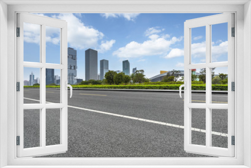 Fototapeta Naklejka Na Ścianę Okno 3D - empty asphalt road with city skyline background in china.