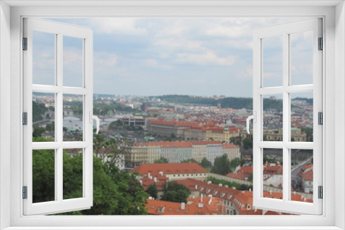Fototapeta Naklejka Na Ścianę Okno 3D - Panorama of Prague, view of the city roofs and domes of churches