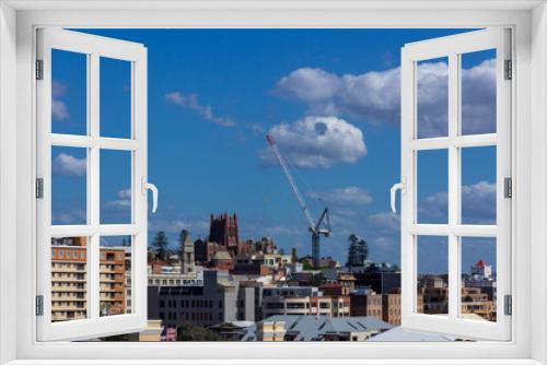 Fototapeta Naklejka Na Ścianę Okno 3D - tower crane on the construction building in the city with blue sky background.