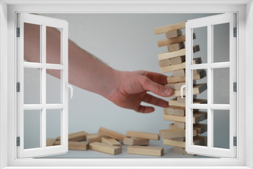 Fototapeta Naklejka Na Ścianę Okno 3D - Board game jenga tower of wood sticks