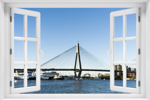 Fototapeta Naklejka Na Ścianę Okno 3D - Peak hour on Anzac Bridge, Sydney, Australia. Water views to Sydney Harbour Bridge