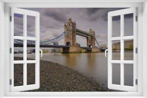 Fototapeta Naklejka Na Ścianę Okno 3D - a view of tower bridge of London with cloudy dark sky in the background