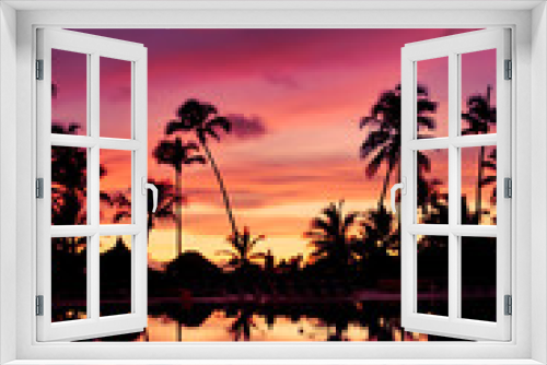 Fototapeta Naklejka Na Ścianę Okno 3D - Blue pink and red sunset over sea beach with palms