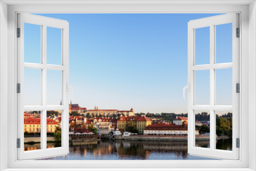 View over Vltava River towards Lesser Town and Castle at sunrise, Prague, Bohemia Region, Czech Republic