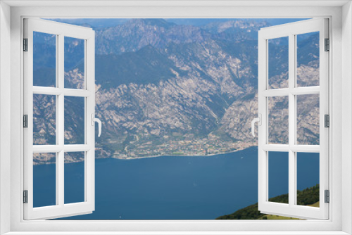 Fototapeta Naklejka Na Ścianę Okno 3D - Lake Garda (Italy) and the mountains that surround it seen from the top of Monte Baldo. Italian landscape.