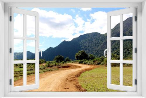 Fototapeta Naklejka Na Ścianę Okno 3D - Country roads at Vang Vieng, Laos : The view of two side filled with beautiful mountains