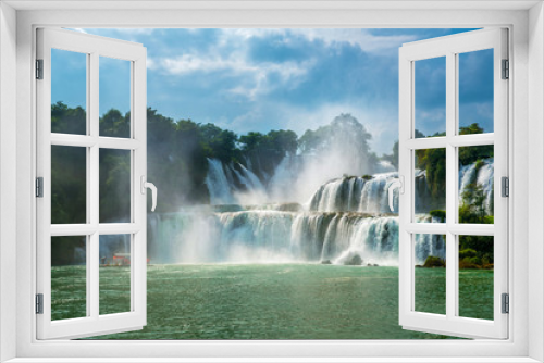 Fototapeta Naklejka Na Ścianę Okno 3D - Bangioc - Detian waterfall is locate at border of China and Vietnam, It's famous water fall of both country. There are boat service tourist for see nearby the waterfall.