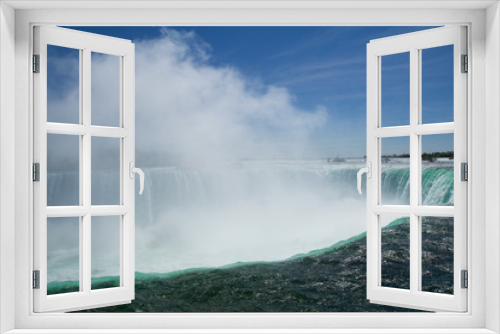 Fototapeta Naklejka Na Ścianę Okno 3D - NIAGARA FALLS, ONTARIO, CANADA - MAY 21st 2018: Edge of the Horseshoe Falls as viewed from Table Rock in Queen Victoria Park in Niagara Falls