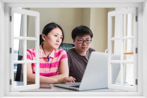 young woman and man working with computer