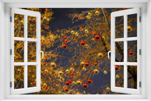 Fototapeta Naklejka Na Ścianę Okno 3D - Image of tree with gold and red balls on background of building