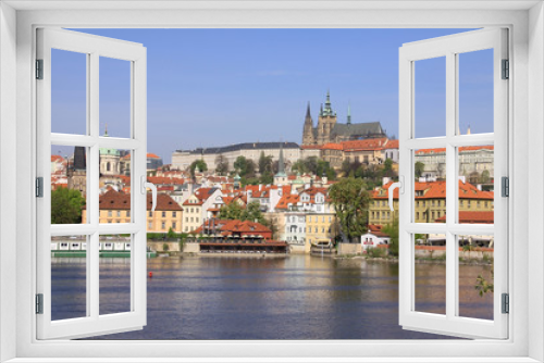 Fototapeta Naklejka Na Ścianę Okno 3D - Prague's St. Nicholas' Cathedral with Prague Castle