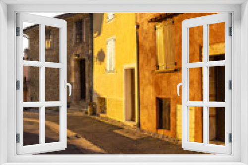 Fototapeta Naklejka Na Ścianę Okno 3D - street and colourful houses of the Provence beamed by morning light, village Sainte-Croix-du-Verdon, department Alpes-de-Haute-Provence, region Provence-Alpes-Côte d’Azur