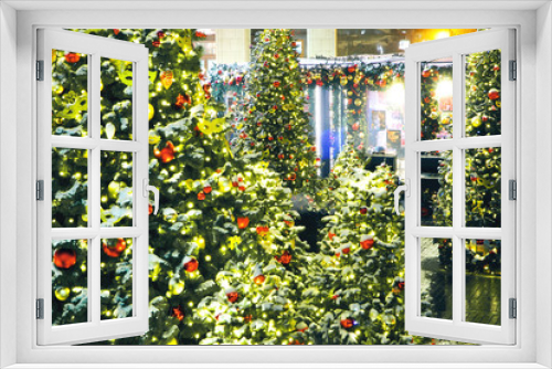 Fototapeta Naklejka Na Ścianę Okno 3D - Colorful blured christmas Decoration. Winter holidays and traditional ornaments. Lighting chains-bulbs for seasonal background.