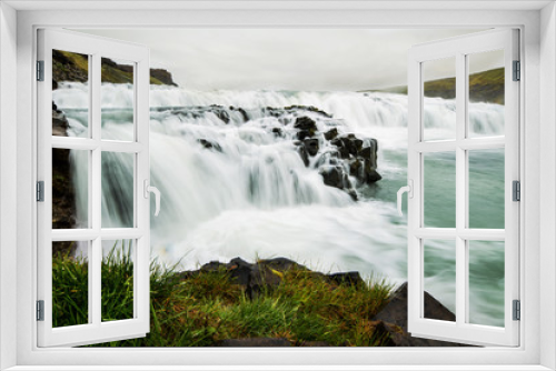 Fototapeta Naklejka Na Ścianę Okno 3D - A waterfall in a beautiful Iceland landscape.