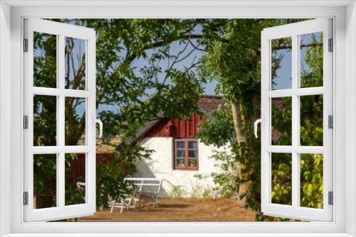 Fototapeta Naklejka Na Ścianę Okno 3D - Traditional old cottage on the swedish island of Oland, Sweden, on a warm summer day.