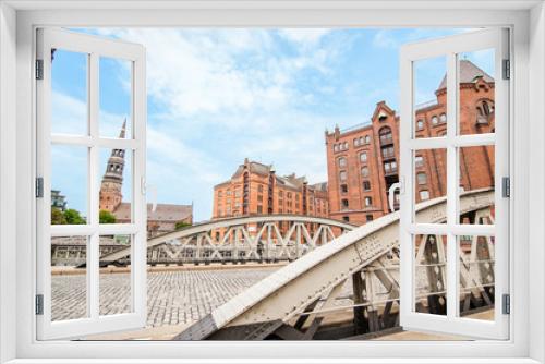 Fototapeta Naklejka Na Ścianę Okno 3D - View of the Warehouses District or Speicherstadt or Hafencity in Hamburg, Germany, the largest warehouse district in the world and it is located in the port of Hamburg