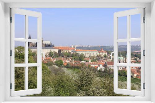 Fototapeta Naklejka Na Ścianę Okno 3D - Prague's gothic Castle with flowering trees and grass