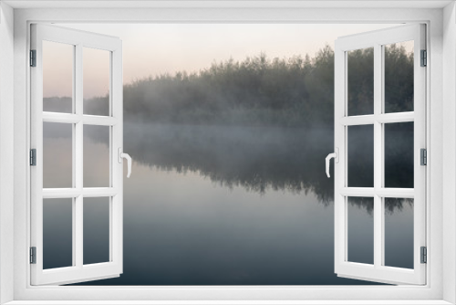 Fototapeta Naklejka Na Ścianę Okno 3D - an misty morning at the water