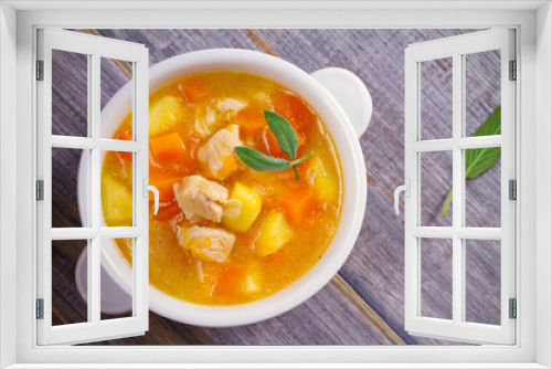 Fototapeta Naklejka Na Ścianę Okno 3D - Chicken, butternut squash, apple, ginger and sage stew in white bowl on wooden table. Pumpkin soup with chicken. overhead, horizontal