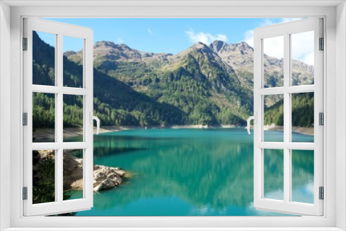Fototapeta Naklejka Na Ścianę Okno 3D - paesaggio lago montagna natura riflesso acqua cime cielo azzurro riva rocce veduta scenico