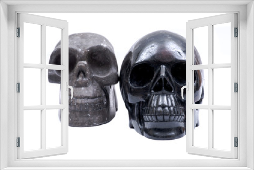 Fototapeta Naklejka Na Ścianę Okno 3D - Black realistic with Astrophyllite blades from Russia and volcanic carved stone skull isolated on white background