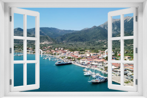 Fototapeta Naklejka Na Ścianę Okno 3D - Aerial drone bird's eye view photo of iconic port of Nidri or Nydri a safe harbor for sail boats and famous for trips to Meganisi, Skorpios and other Ionian islands, Leflkada island, Ionian, Greece