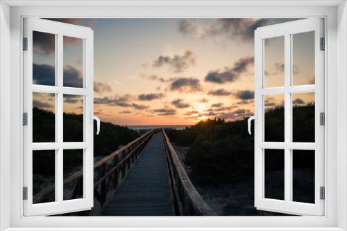 Fototapeta Naklejka Na Ścianę Okno 3D - Steg in den Sonnenaufgang
