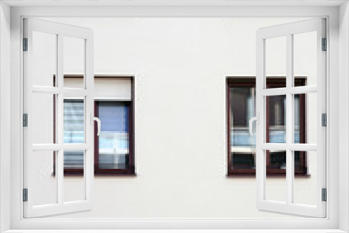 Fototapeta Naklejka Na Ścianę Okno 3D - Spieglungen in den Fenstern eines Wohngebäudes / Die Fassade eines Wohngebäudes mit Fenstern in denen sich die Umgebung spiegelt. ..