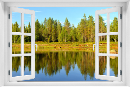Fototapeta Naklejka Na Ścianę Okno 3D - Summer landscape in Finnish Lapland.  Reflection in forest lake