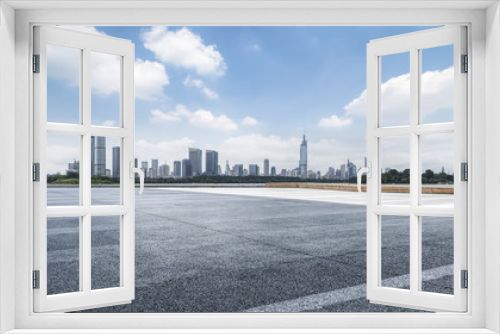 Fototapeta Naklejka Na Ścianę Okno 3D - Panoramic skyline and modern business office buildings with empty road,empty concrete square floor