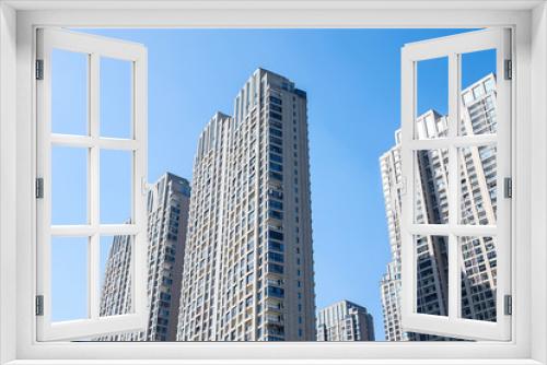 Fototapeta Naklejka Na Ścianę Okno 3D - Intensive high-rise real estate windows