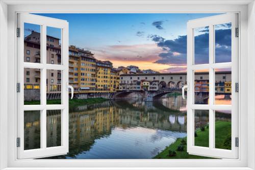 Fototapeta Naklejka Na Ścianę Okno 3D - Evening view of the famous bridge Ponte Vecchio on the river Arno in Florence, Italy.