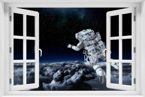 Fototapeta Naklejka Na Ścianę Okno 3D - Astronaut on space mission. Mixed media