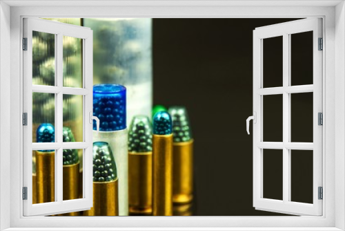 Fototapeta Naklejka Na Ścianę Okno 3D - Shotgun shell cartridge on black background. Detail of shotgun ammunition. Sale of weapons and ammunition. Hunting season.