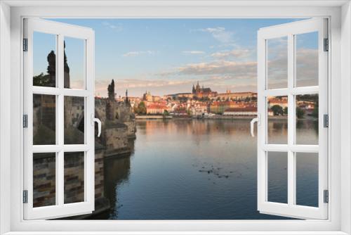 Fototapeta Naklejka Na Ścianę Okno 3D - A view of the castle overlooking the Vtlava River in Prague