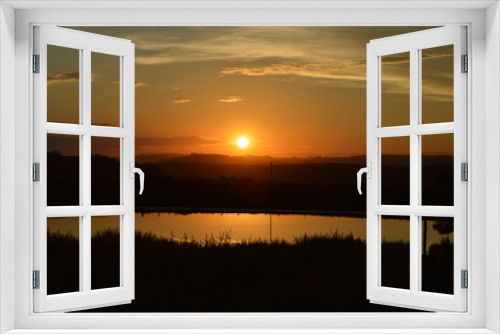 Fototapeta Naklejka Na Ścianę Okno 3D - Sunset over a lake